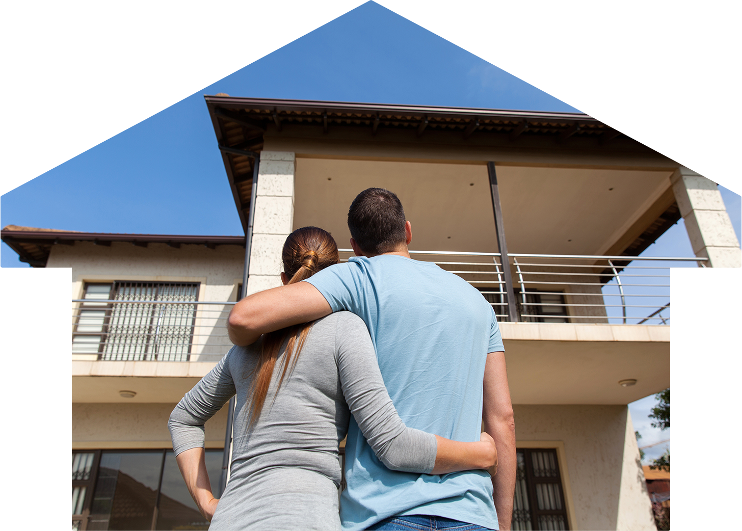 A couple looks up at an apartment