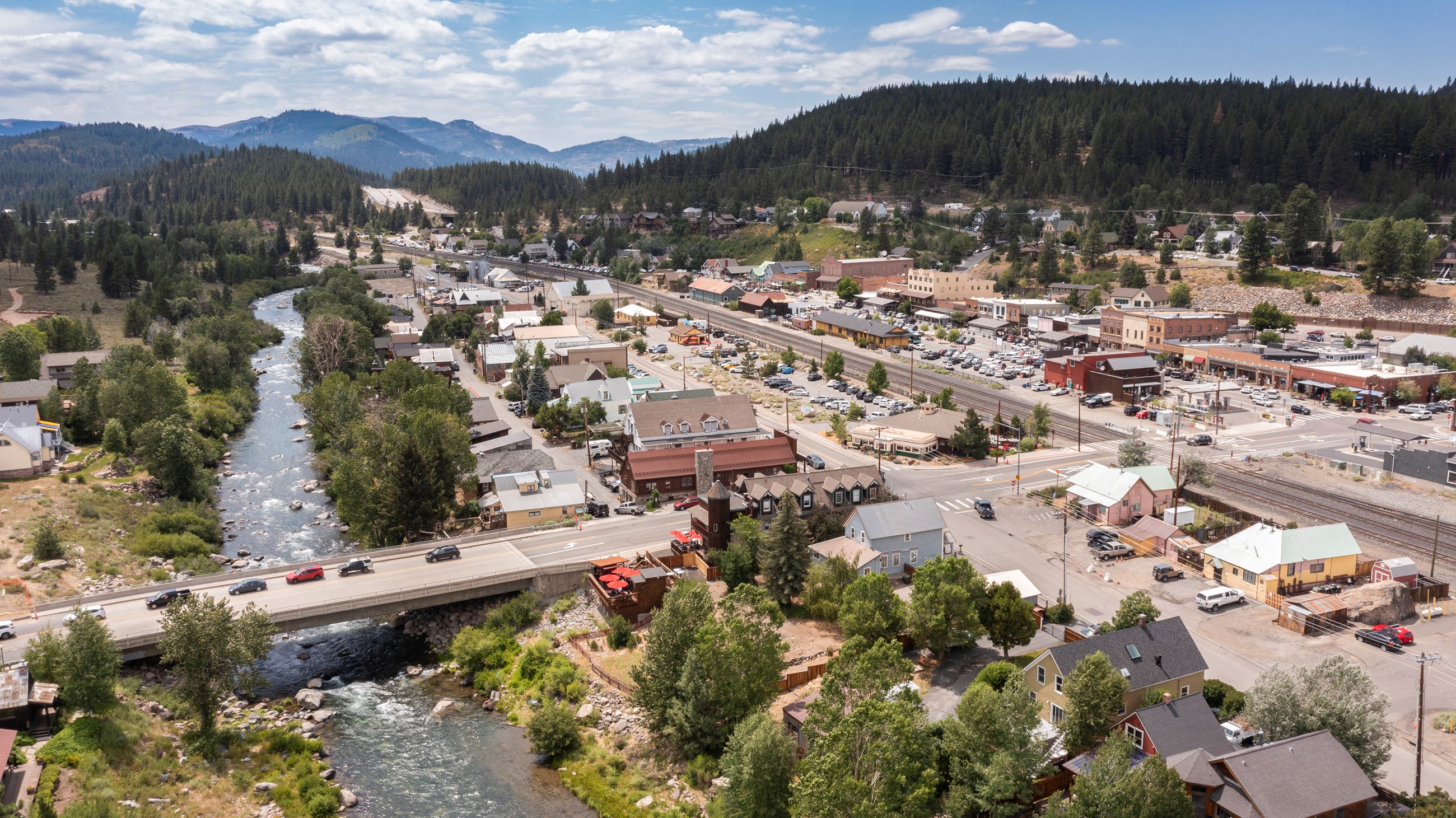 Birds-eye view of Truckee River and Downtown Truckee on sunny day. 