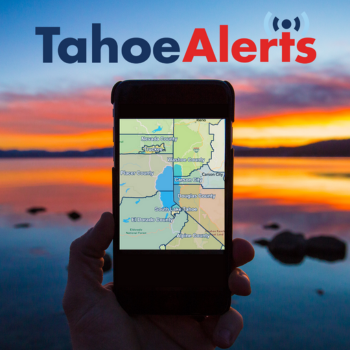 Someone holding a phone in front of a Tahoe sunset with a map up of the area with Tahoe Alerts logo