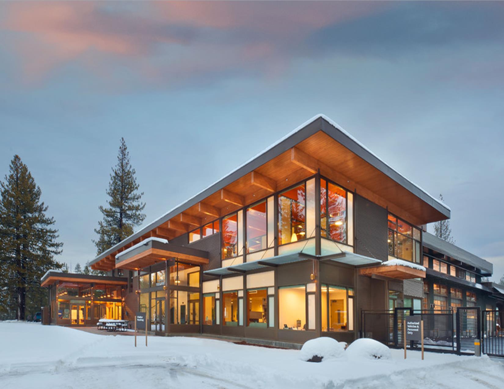 Image of the Stevens Lane Corp Yard with snow and sunset.
