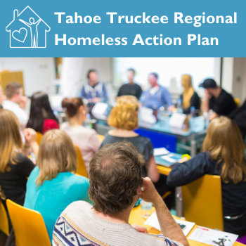 People sitting at tables in a meeting. 