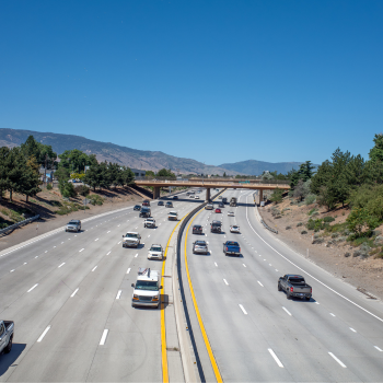 Birds-eye view of I80 Highway to Reno with mountains in background. 