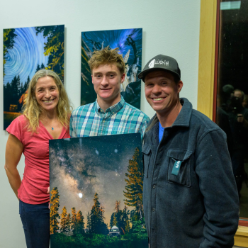 Youth photography winner, Drew Basile, pictured with his winning piece and parents. 
