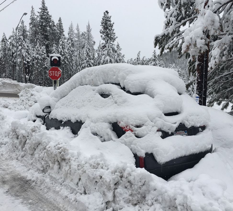 Parked Car Covered in Snow