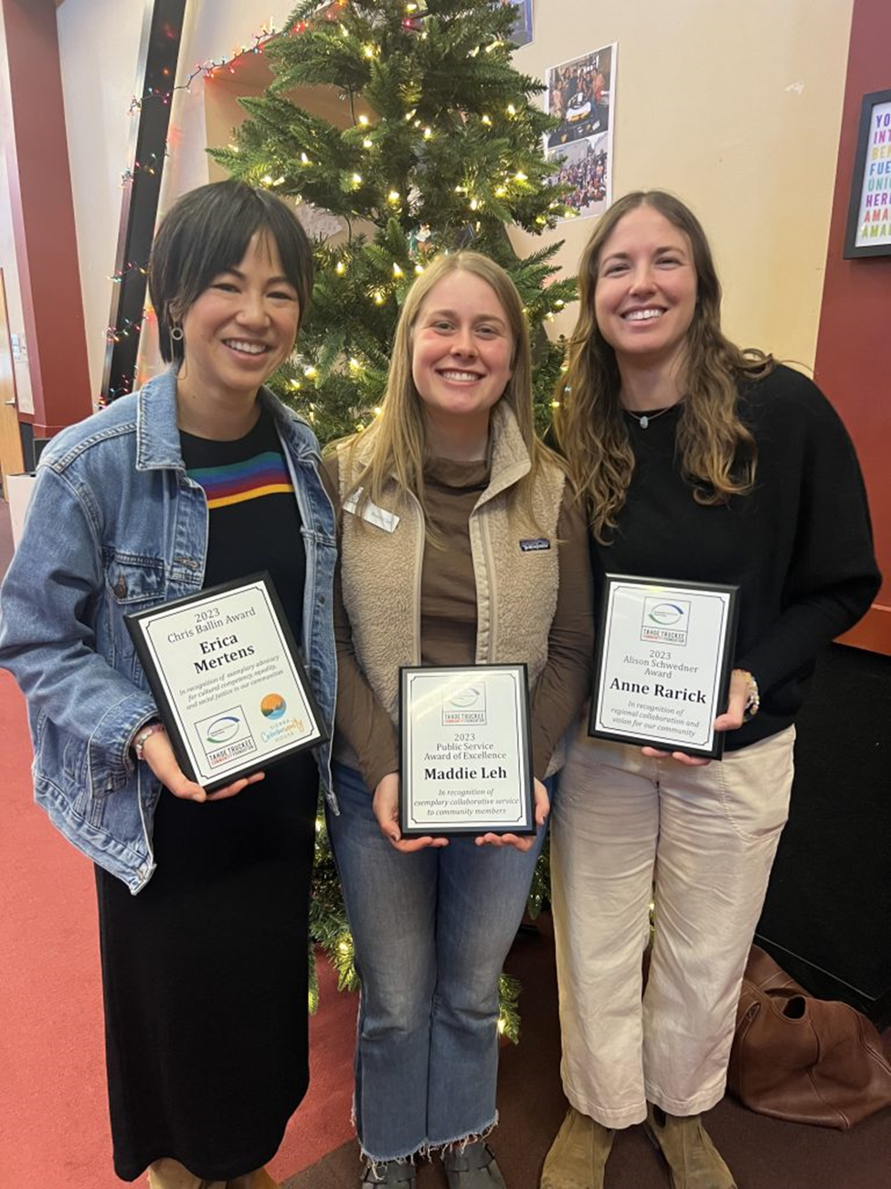 Three women posing with their awards. Erica Mertens, Maddie Leh and Anne Rarick. 